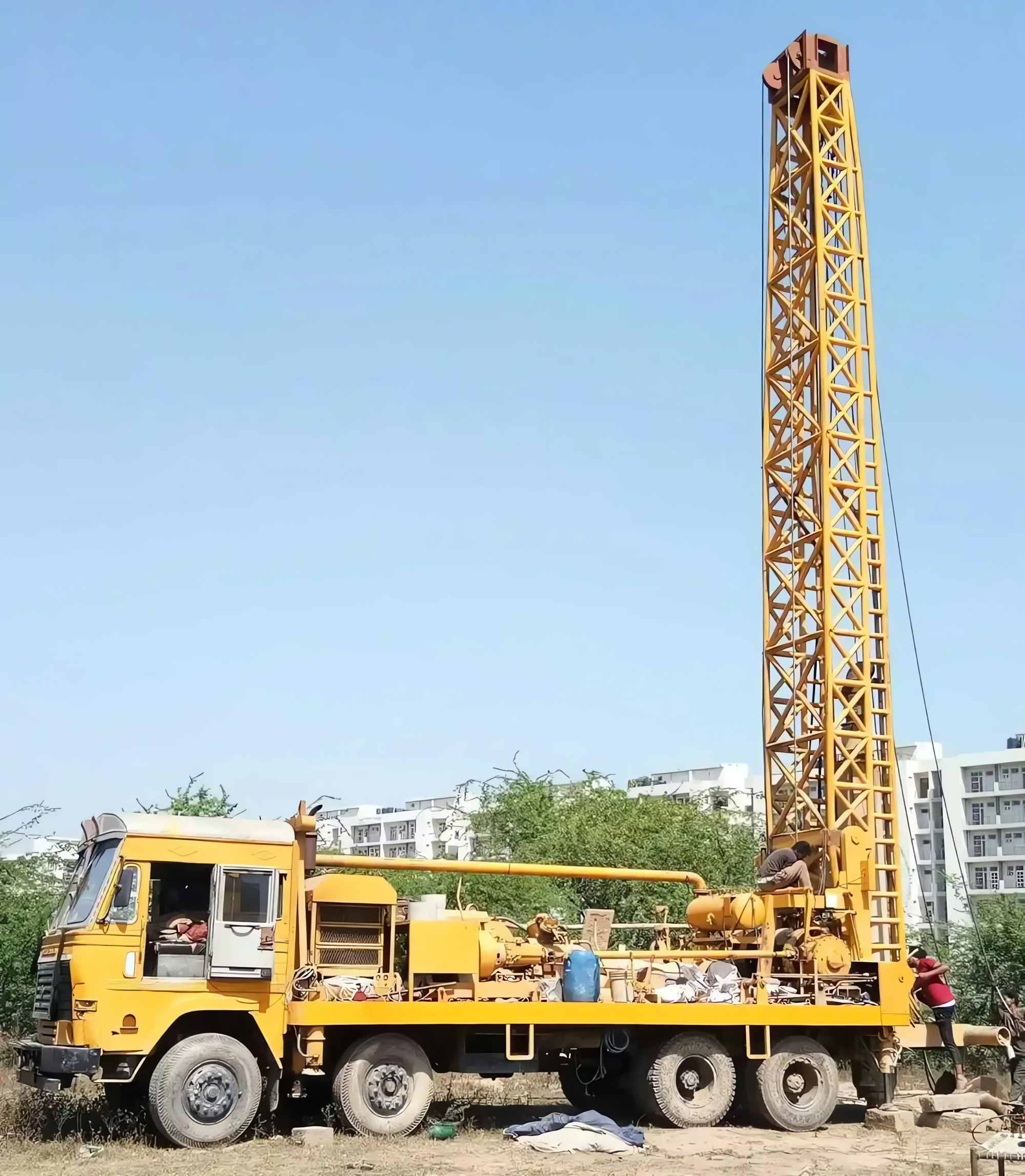 Tube well drilling rig on site